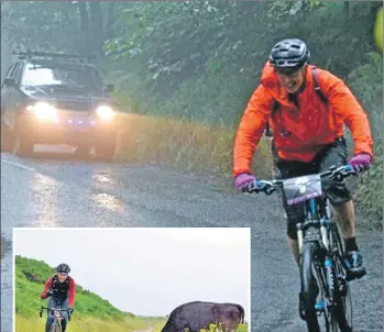  ??  ?? A cyclist, suitably dressed for the weather, enjoys a tarred section of road during the Grinduro race.