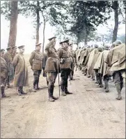  ?? GEORGE METCALF ARCHIVAL COLLECTION, CANADIAN WAR MUSEUM. IMAGE COLOURIZED BY CANADIAN COLOUR ?? General Mewburn and Lieutenant-General Currie with marching soldiers, August 1918.