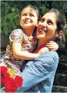  ??  ?? Nazanin Zaghari-Ratcliffe with her daughter during temporary release