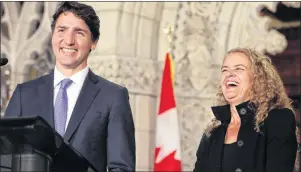  ?? CP PHOTO ?? Prime Minister Justin Trudeau shares a laugh with former astronaut, and Governor General designate Julie Payette on Parliament Hill in Ottawa July 13.