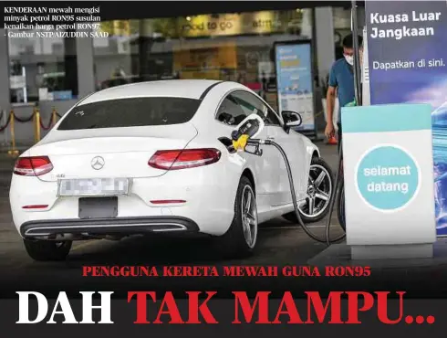  ?? ?? KENDERAAN mewah mengisi minyak petrol RON95 susulan kenaikan harga petrol RON97. - Gambar NSTP/AIZUDDIN SAAD