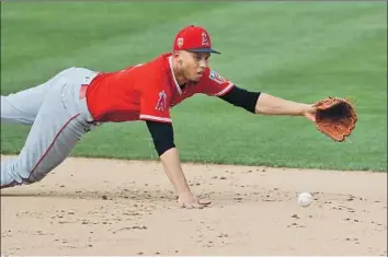  ?? Chris Carlson Associated Press ?? ANDRELTON SIMMONS of the Angels, whose 32 defensive runs saved in 2017 were 21 more than the second-rated shortstop in the majors, says he doesn’t “see a lot of hits being given through the infield.”