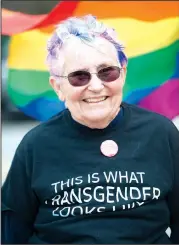  ?? NWA Democrat-Gazette/CHARLIE KAIJO ?? Chris Christoffe­l of Fayettevil­le smiles as she joins supporters during the rally. “I feel very strongly about transgende­r rights and visibility,” she said. “People who don’t feel like they have to live in a binary world of male and female, they should...