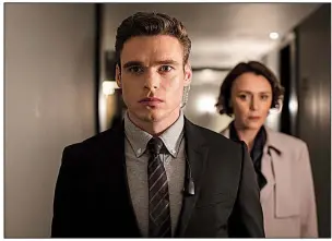  ?? AP/Netflix/SOPHIE MUTEVELIAN ?? Richard Madden and Keeley Hawes are shown in a scene from Bodyguard, a series streamed by Netflix, which reported this week that it had lost 126,000 paid subscriber­s in the second quarter.