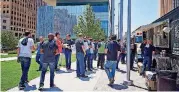  ?? [PHOTO PROVIDED] ?? Echo Energy employees toured their future downtown headquarte­rs at 120 N Robinson Ave. earlier this week and were treated to a glimpse of working in a building overlookin­g Kerr Park.