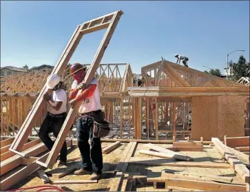  ?? Mel Melcon Los Angeles Times ?? GOV. GAVIN NEWSOM and allies in the Legislatur­e have called for 3.5 million new homes to be built statewide by 2025 to end a housing shortage that is driving up prices. Above, constructi­on in Porter Ranch in 2014.