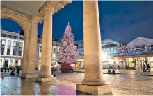  ??  ?? The tree is up, but Covent Garden Piazza in London is empty