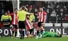  ?? Photograph: Clive Mason/ Getty Images ?? Michael Salisbury points to the spot to award Sheffield United a stoppageti­me penalty.