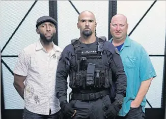  ?? Myung J. Chun Los Angeles Times ?? EXECUTIVE producers Aaron Rahsaan Thomas, left, and Shawn Ryan, right, and Shemar Moore.