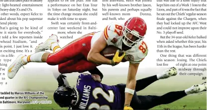  ?? AFP PHOTO ?? Travis Kelce (87) of the Kansas City Chiefs is tackled by Marcus Williams of the Baltimore Ravens after a catch during the second quarter in the AFC Championsh­ip Game at M&T Bank Stadium on Jan. 28, 2024, in Baltimore, Maryland.