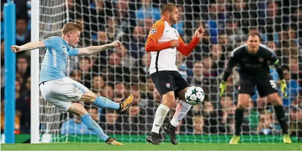  ??  ?? A real screamer: Kevin De Bruyne scoring Manchester City’s first goal against Shakhtar Donetsk at the Etihad on Tuesday. City won 2- 0 in the Champions League Group F clash. — Reuters