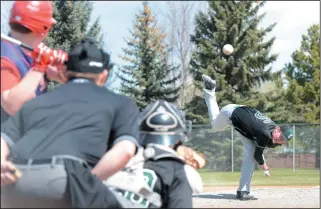  ?? NEWS PHOTO RYAN MCCRACKEN ?? Hat High Mohawks pitcher Dylan Koenig throws to catcher Zach Stark during Saturday's Southern Alberta High School Baseball League game against the Maple Creek Red Sox at Jeffries Field.