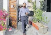  ?? SUNIL GHOSH/HT ?? IAS Vimal Kumar Sharma comes out of his Noida residence as income tax officials carry out a raid on Wednesday.