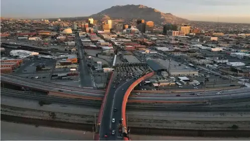  ?? The Associated Press ?? Cars line up Nov. 8 at the Paso del Norte internatio­nal bridge in Ciudad Juarez, Mexico, below, on the border with El Paso, Texas, top. Two men who forged deep bonds of friendship while serving in the U.S. Army in Afghanista­n would be arrested in 2018 for a scheme to steal weapons and explosives from an armory at Fort Bragg, North Carolina, and sell them. An Associated Press investigat­ion into lost and stolen military weapons has shown that insider thefts remain a serious concern.