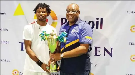  ??  ?? L-R: Winner of the Men’s Singles, Joseph Imeh and Group Managing Director of Rainoil Limited, Dr. Gabriel Ogbechie, during the prize presentati­on ceremony of the 2nd edition of the Rainoil Open Tennis Championsh­ip at Ikoyi Club, Lagos...on Saturday