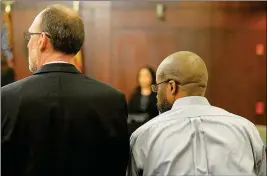  ?? Buy this photo at YumaSun.com PHOTO BY RANDY HOEFT/YUMA SUN ?? PRESTON STRONG (RIGHT) AND CO-DEFENSE ATTORNEY William Fox listen as the jury is polled Tuesday afternoon after finding Strong guilty of murdering two adults and four children in the 2005 La Mesa Street murders.