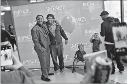  ?? [ERIC ALBRECHT/DISPATCH] ?? Joseph Love Jr. poses with his father, Joseph Love Sr., right, while twins Treymar and Joseph Love sneak in on the photo. Joseph Jr. said one of his motivating factors in completing the program was to ensure he could provide for his family.