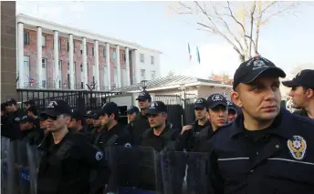  ?? — AFP file photo ?? Turkish riot police stand as protesters demonstrat­e against France in front of the French embassy in Ankara.