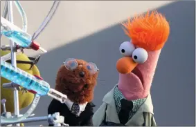  ?? DISNEY+/TNS ?? Dr. Bunsen Honeydew and Beaker investigat­e sound waves on “Muppets Now.”