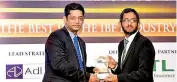  ??  ?? Amãna Bank’s Manager – Corporate Communicat­ions & Marketing Azim Rali receiving the award for Marketing Campaign of the Year