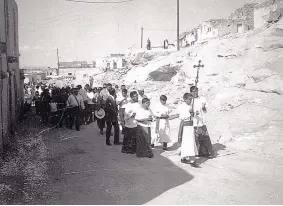  ??  ?? Patrons and altar boys participat­e in a procession for the San José de Laguna church. The date of the photo is not known.