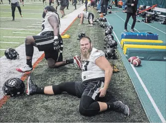  ?? JASON FRANSON THE CANADIAN PRESS ?? Ottawa Redblacks’ Jon Gott stretches during practice in preparatio­n for the Grey Cup in Edmonton.