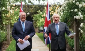  ?? Dominic Lipinski/PA ?? Then Australian prime minister Scott Morrison and Boris Johnson in the garden at Downing Street in 2021 after agreeing the broad terms of a free trade deal. Photograph: