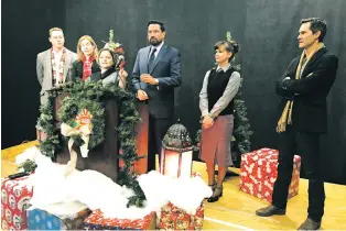  ?? ROBERT NOTT/THE NEW MEXICAN ?? Mayor Javier Gonzales, center, is flanked by members of the production team of the independen­t movie Santa Fake, which will begin shooting in Santa Fe on Dec. 27, during a news conference Saturday on the project.