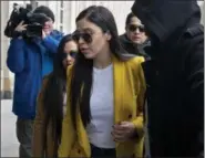  ?? CRAIG RUTTLE — THE ASSOCIATED PRESS ?? Emma Coronel Aispuro, center, wife of Joaquin “El Chapo” Guzman, arrives at federal court Monday in New York. A jury is deliberati­ng at the U.S. trial of the infamous Mexican drug lord.