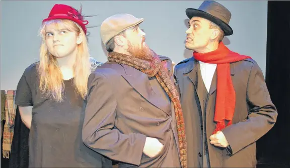  ?? SALLY COLE/THE GUARDIAN ?? Belle (Sophie MacInnis), Bob Cratchit (Nason Scribner) and Scrooge (Noah Nazim) appear in a photo for “An Improvised Christmas Carol”. After opening Thursday night, the show continues on Dec. 13 and 20 at The Guild in Charlottet­own.