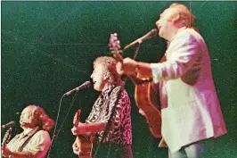  ?? LANNIS WATERS / THE PALM BEACH POST ?? Music legends David Crosby (from left), Graham Nash and Stephen Stills close out SunFest in 1991.