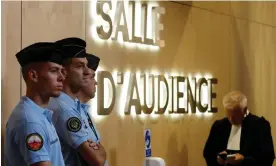  ?? ?? French gendarmes and a lawyer standing outside the temporary courtroom set up for the trial of eight people over the 14 July 2016 attack in Nice. Photograph: Christian Hartmann/ Reuters