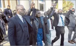  ?? STEPHEN B. MORTON — THE ASSOCIATED PRESS ?? Ahmaud Arbery’s mother, Wanda Cooper-Jones, center, walks out of the Glynn County Courthouse surrounded by supporters after a judge sentenced Greg McMichael, his son, Travis McMichael, and a neighbor, William “Roddie” Bryan, to life in prison Friday.