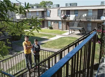  ?? Jon Shapley / Staff photograph­er ?? Students like Hamed Durrani, left, 15, and his brother Yousuf, 8, are at greater risk of falling behind their peers next year because of language barriers and other e-learning obstacles.