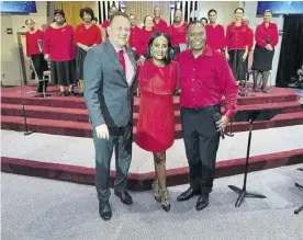  ?? ?? South Florida Caribbean Chorale founder and director, Steve Higgings (right) is joined on stage by Jamaica’s Consul General in Miami Oliver Mair and Alison Smith, president of the Broward County Bar Associatio­n, for Christmas carolling at the Plantation Methodist United Church in Broward County, Florida.