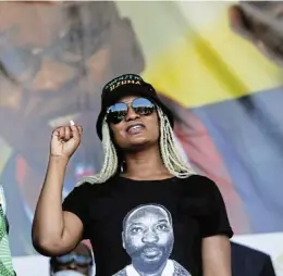  ?? ?? Back home: Duduzile Zuma stands in front of a large photo of her father, former president Jacob Zuma, at a ‘welcome prayer’ held for him in Durban on Thursday after he returned home on medical parole after serving two months of his contempt of court sentence.