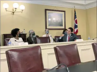  ?? ANDREW WELSH-HUGGINS — THE ASSOCIATED PRESS FILE ?? Ohio Elections Chief Frank LaRose, right, talks about his desire for a new, 10-year map of the state’s legislativ­e districts at a meeting of the Ohio Redistrict­ing Commission, Aug. 31, 2021, in Columbus, Ohio, as Rep. Emilia Sykes, of Akron, listens. The election contests of 2022may have been held and decided, but Ohio’s political maps remain far from settled. What was supposed to be a once-per-decade process for redrawing the state’s U.S. House and Statehouse districts to reflect updated 2020popula­tion figures now promises to extend into 2023, and probably longer.