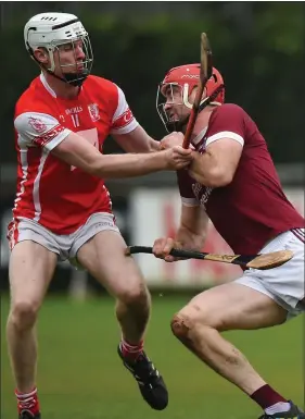  ??  ?? Daithí Waters of St. Martin’s is challenged by Cuala attacker Colm Cronin.