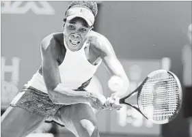  ?? CHARLES TRAINOR JR. MIAMI HERALD ?? Venus Williams returns a ball to Kiki Bertens on Sunday.