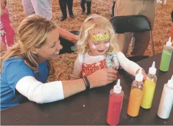  ?? STAFF FILE PHOTO ?? Carnival games such as Go Fish, where youngsters can cast a line for a grab bag of goodies, are an important part of the Autumn Children’s Festival.