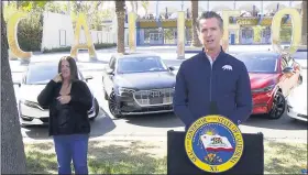  ?? POOL VIA AP ?? This screen shot from pool video shows California Gov. Gavin Newsom announcing Wednesday, Sept. 23, that the state will halt sales of new gasoline-powered passenger cars and trucks by 2035, in Sacramento, Calif. OnWednesda­y he ordered state regulators to come up with requiremen­ts to meet that goal. California would be the first state with such a rule, though Germany and France are among 15other countries that have a similar requiremen­t.