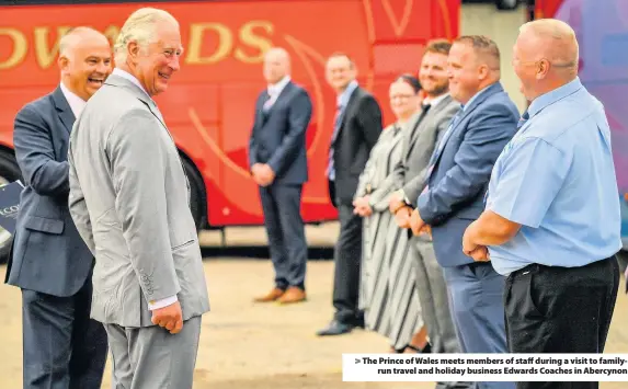  ??  ?? > The Prince of Wales meets members of staff during a visit to familyrun travel and holiday business Edwards Coaches in Abercynon