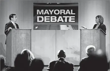  ?? [JOHN MINCHILLO/THE ASSOCIATED PRESS] ?? Cincinnati Mayor John Cranley, left, and City Council member Yvette Simpson participat­e in a mayoral debate on Tuesday. Both candidates are Democrats. The party hopes that strong candidates in urban areas will help rebuild its Ohio base after a sweep...