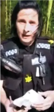  ??  ?? Patrol: The officer, wearing daffodil charity badges, on David’s Taylor’s phone video