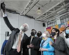  ?? NATHAN DENETTE THE CANADIAN PRESS ?? Ontario NDP leader Andrea Horwath, centre, poses for a selfie after delivering her Ontario provincial election campaign platform in Toronto on Monday.