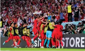  ?? Photograph: Adam Davy/PA ?? South Korea celebrate their winning goal which took them into the knockout stages.