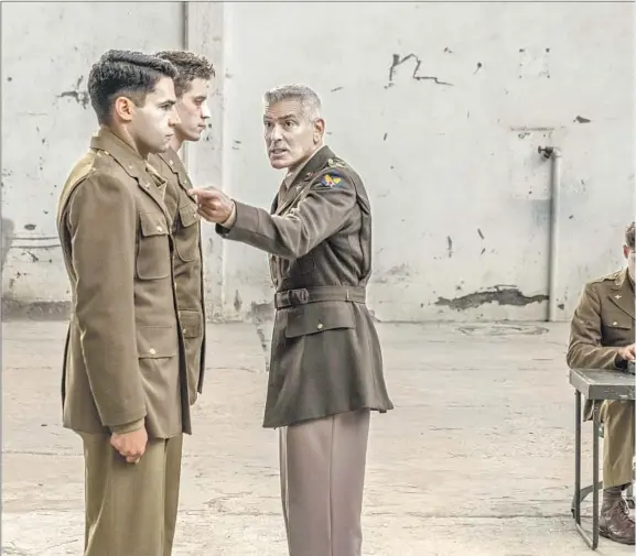  ??  ?? CHRISTOPHE­R ABBOTT, left, Pico Alexander, George Clooney and Lewis Pullman appear in Hulu’s miniseries adaptation of the Joseph Heller novel “Catch-22,” a stalwart of high school English reading lists.