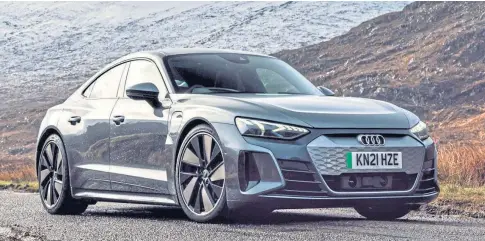  ?? ?? POWERING UP: The Audi e-tron performs superbly, but recharging it from 20% to 100% will cost around £23.