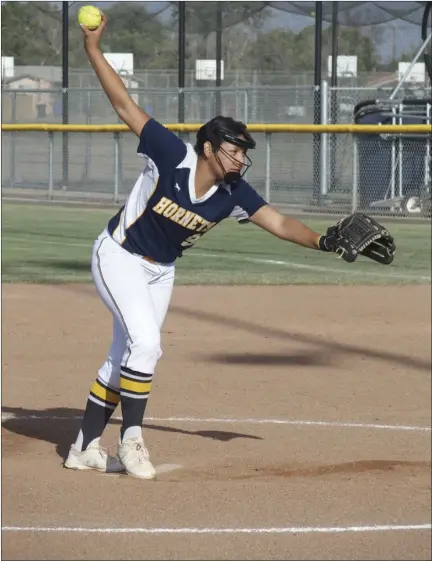  ?? KARINA LOPEZ PHOTO ?? Calipatria High's Jackie Vega prepares to deliver a pitch during the Hornets' CIF-San Diego Section Division IV play-in game against Escondido Charter on Tuesday afternoon in Calipatria.