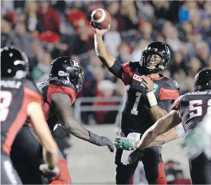  ?? JUSTIN TANG/THE CANADIAN PRESS ?? Redblacks quarterbac­k Henry Burris throws the ball against the Saskatchew­an Roughrider­s during the second half of Friday’s game in Ottawa. Earlier this season, Burris sat out four games with an injured pinky finger, but came back to play last Friday.